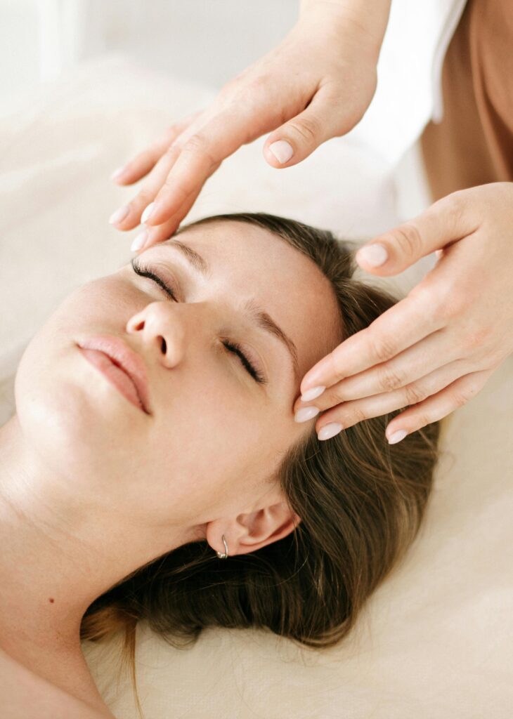 pexels-photo-5659019-5659019 Woman receiving a soothing facial massage in a relaxing spa environment.